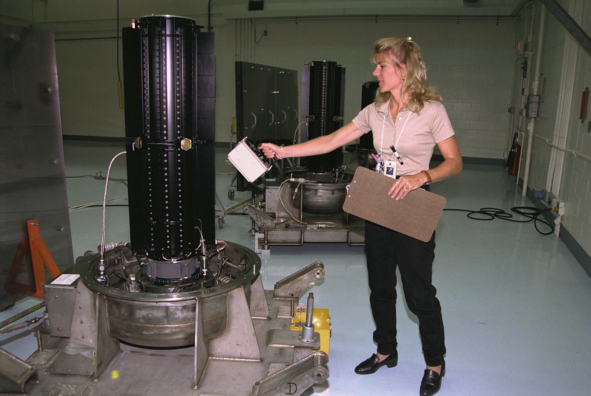 Woman measuring the radiation of an RTG.